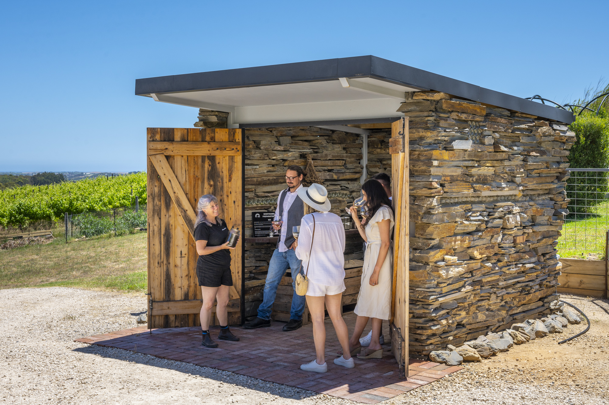 A group has a discussion inside a small building.